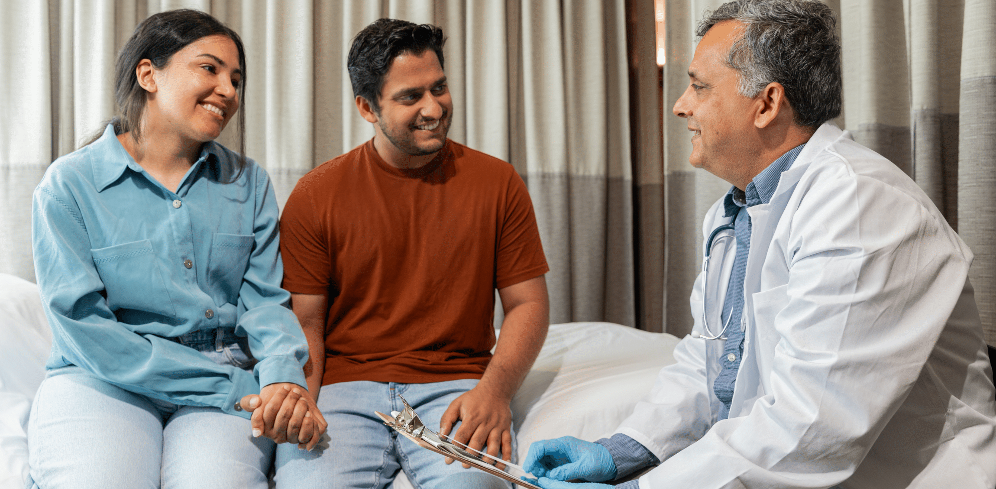 Couple talking to doctor